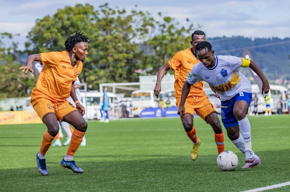 Rayons Sports captain Kevin Muhire tries to go past Bugesera FC defenders during the Peace Cup. The Blues will face Gasogi United in do or die clash on Saturday at Amahoro Stadium. Photo by Emmanuel Dushimimana