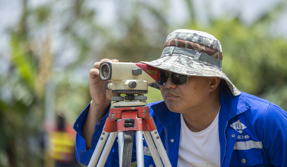 An engineer inspects the ongoing construction works of the 14.5km road that connects Karongi Town to Kiziba, Rwanda’s oldest refugee camp, home to Congolese refugees. Olivier Mugwiza