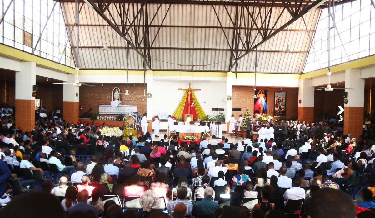 Catholic church believers during a holy communion mass at St Michel in Kigali. Photoo by Craish Bahizi