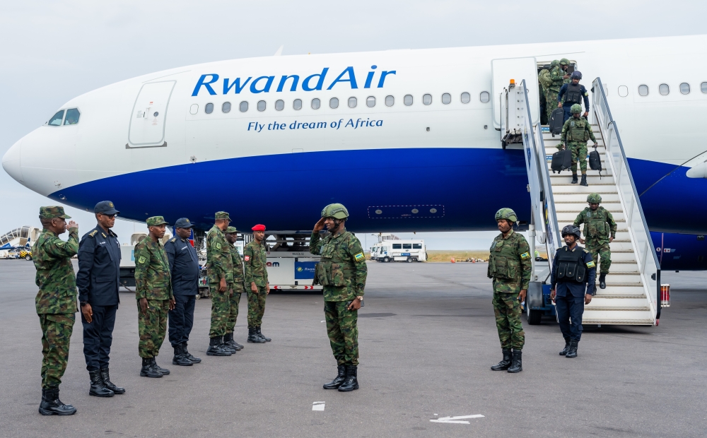 The contingent served under the command of Maj Gen Alex Kagame (centre).