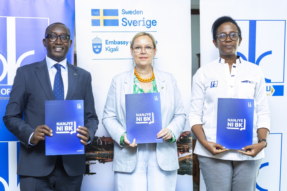 Jean-Bosco Iyacu, CEO of Access to Finance Rwanda, Martina Fors Mohlin, Head of Development Cooperation at the Embassy of Sweden and Dr Diane Karusisi, CEO of the Bank of Kigali, during the signing ceremony.