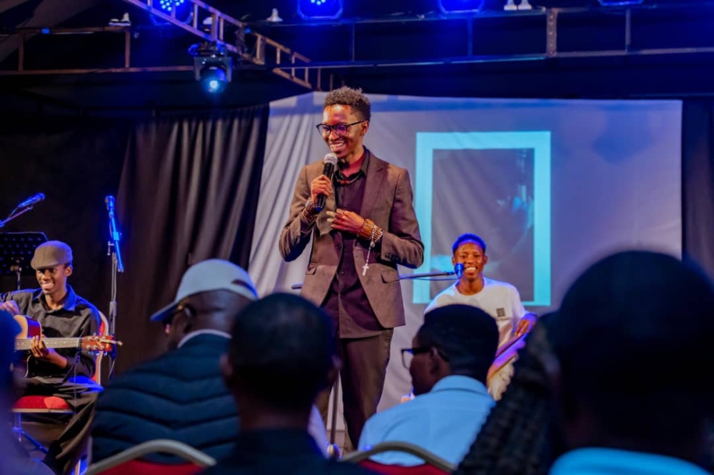 Poet Rumaga speaks during Ibyanzu Vibration Night, the evening of poetry at the Kigali Conference and Exhibition Village,