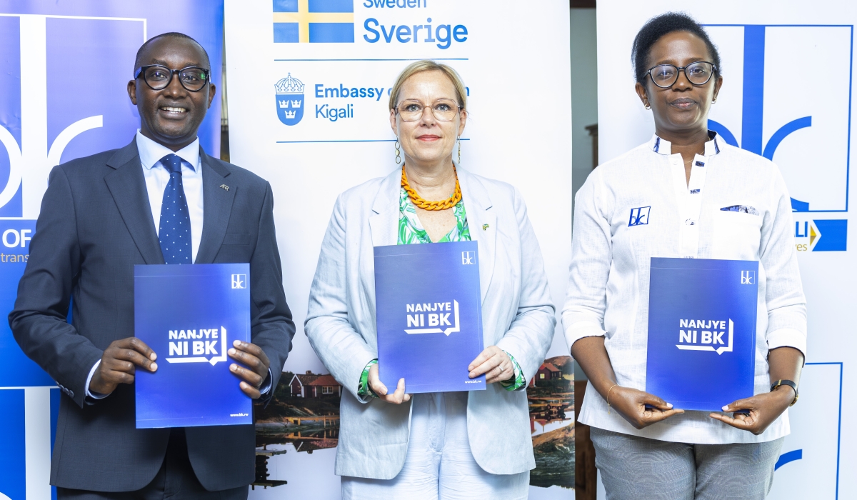 Jean-Bosco Iyacu, CEO of Access to Finance Rwanda, Martina Fors Mohlin, Head of Development Cooperation at the Embassy of Sweden and Dr Diane Karusisi, CEO of the Bank of Kigali, during the signing ceremony.