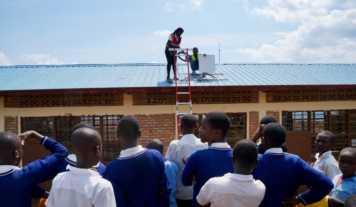 Technicians install Starlink internet at a school in Rwanda. In mid 2023, Rwanda launched Starlink internet in 50 schools countrywide.