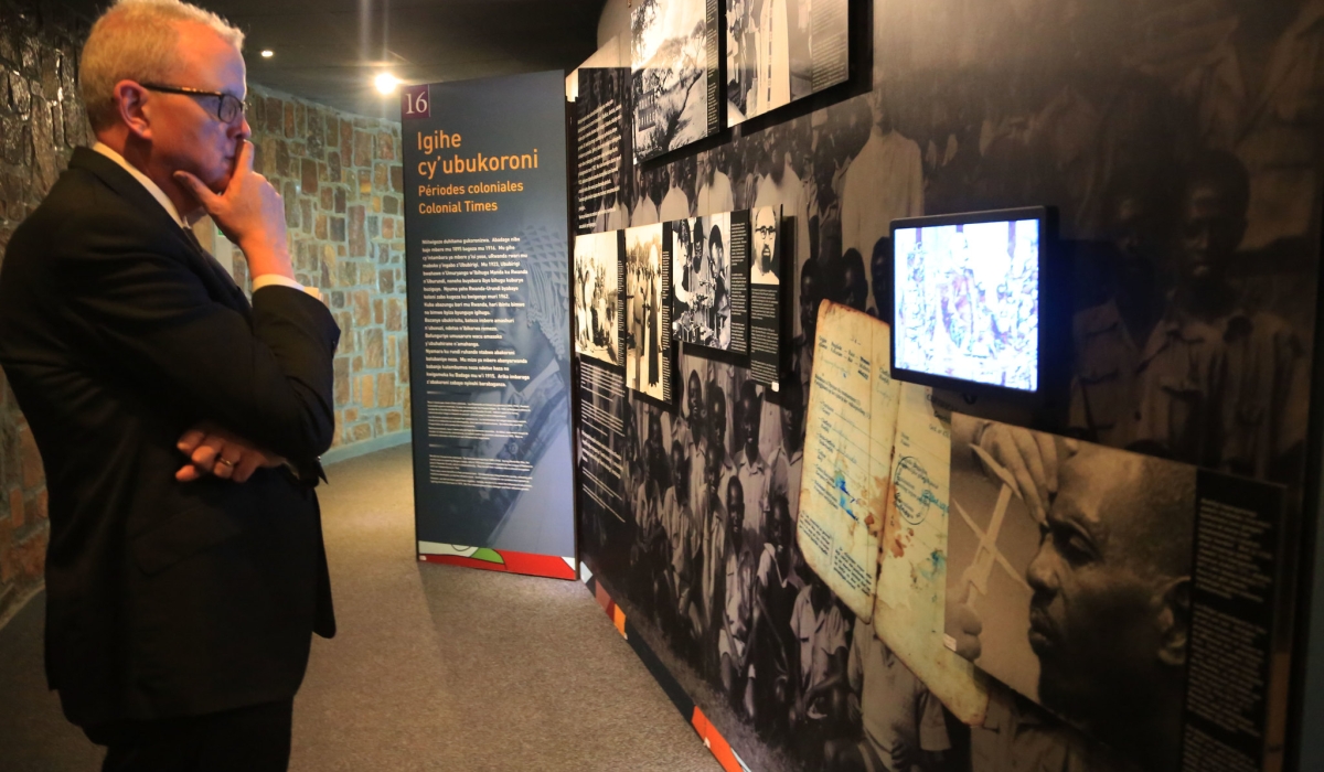 A visitor watches a video on Rwandan history during his tour at Kigali Genocide Memorial. Photo by Sam Ngendahimana