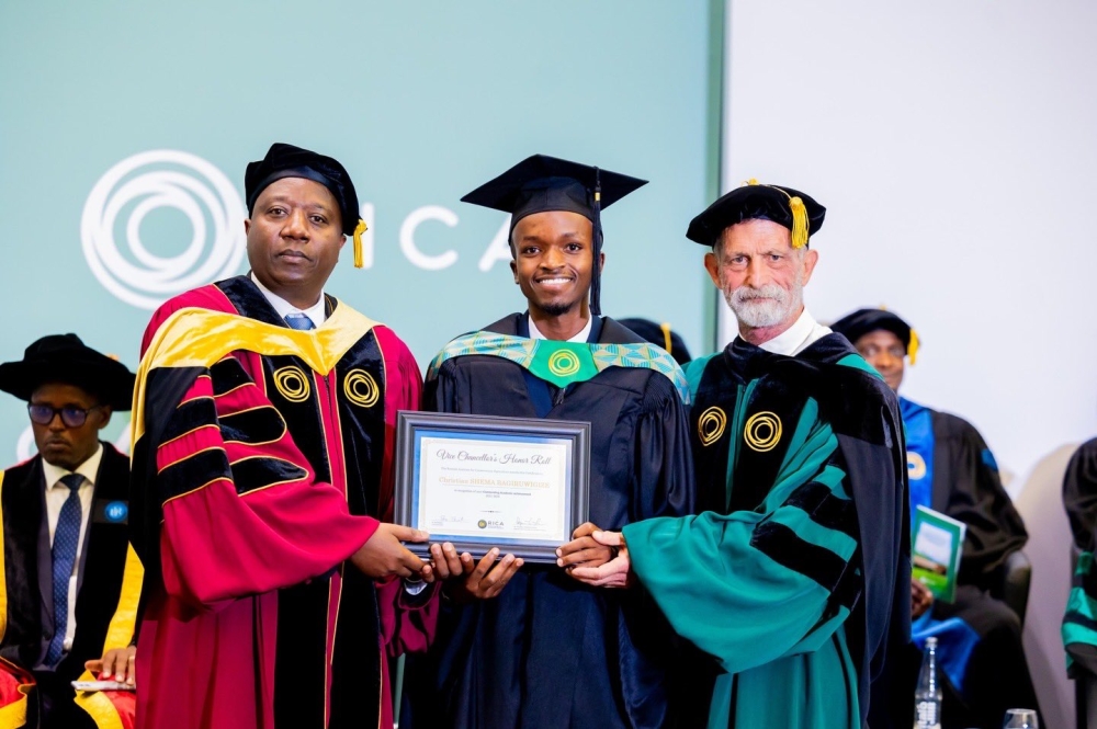 Christian Shema Bagiruwigize (C) receives Vice Chancellor&#039;s Honor Roll recognition presented to her by RICA Vice Chancellor Ron Rosati, and Prime Minister Edouard Ngirente, on September 20, 2024. Photos by Craish Bahizi