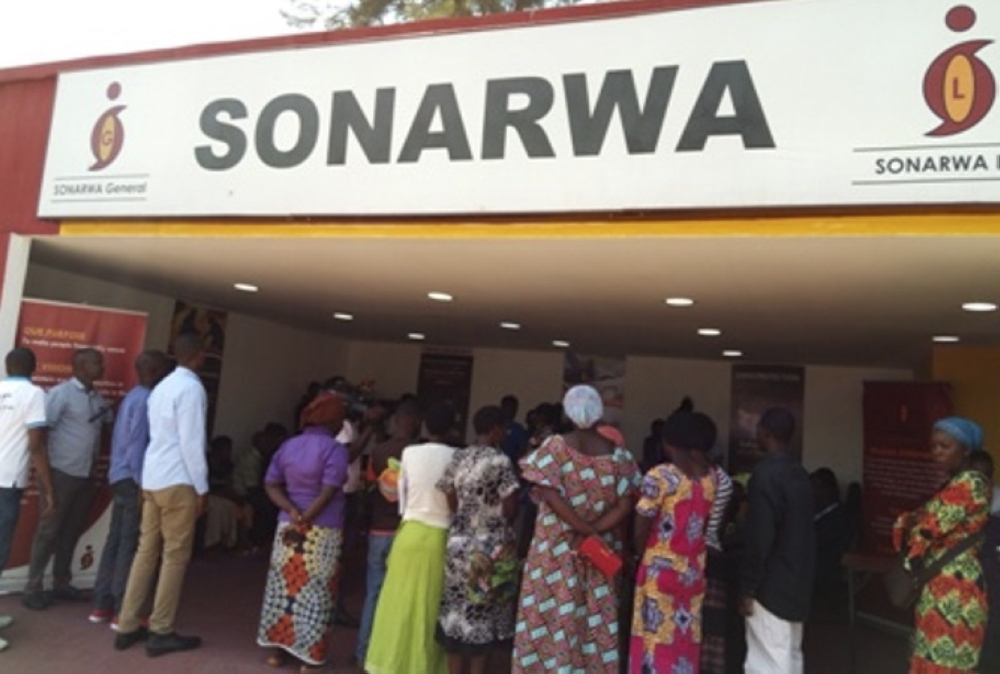 Showgoers at a SONARWA stand during a past trade fair. Sonarwa General Insurance Company Ltd experienced a significant decline in profitability in 2023, reporting a loss of Rwf879 million. File