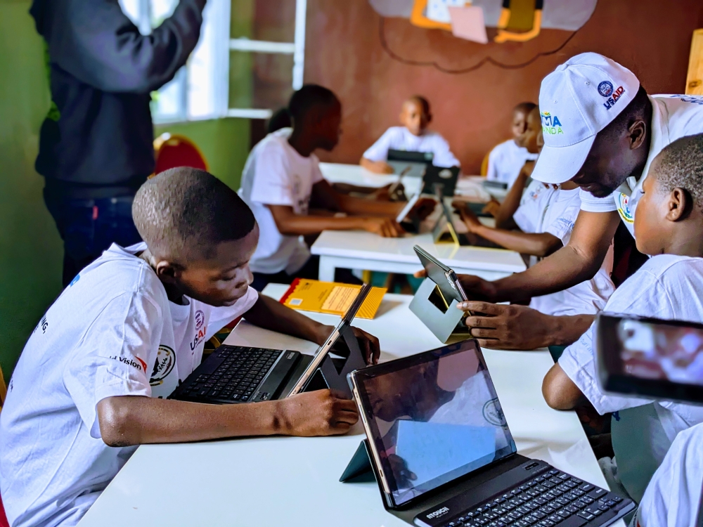 Children browse inside the newly launched library at Nkombo Island in Rusizi District on September 20. Photos by Frank Ntarindwa