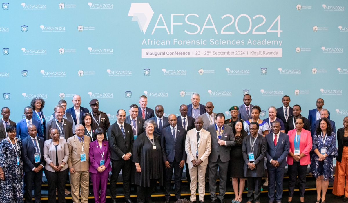 Officials and delegates pose for a group photo at the opening session of the conference at Kigali Convention Centre on September 25.