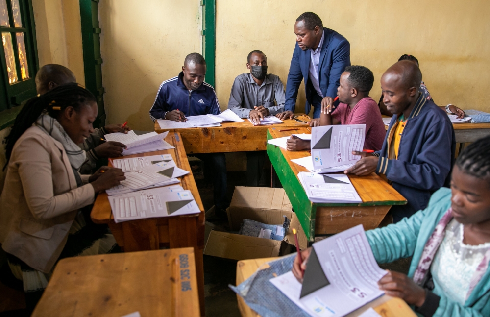 National Examinations and School Inspection Authority Director General Bahati visits exams markers at Groupe Officiel de Butare. Olivier Mugwiza