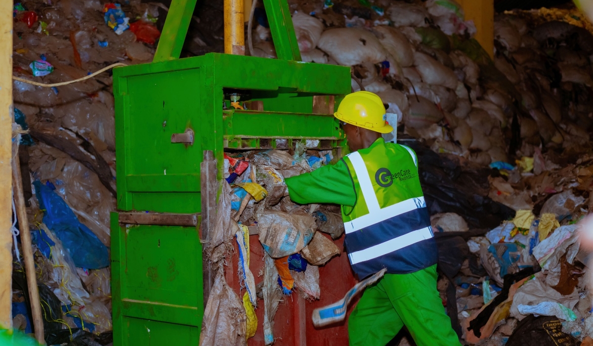 Workers from Green Care Rwanda Ltd sort some plastic waste that are recycled to produce different items, including pavers. Courtesy