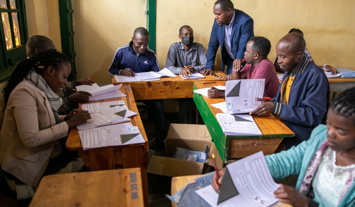 National Examinations and School Inspection Authority Director General Bahati visits exams markers at Groupe Officiel de Butare. Olivier Mugwiza