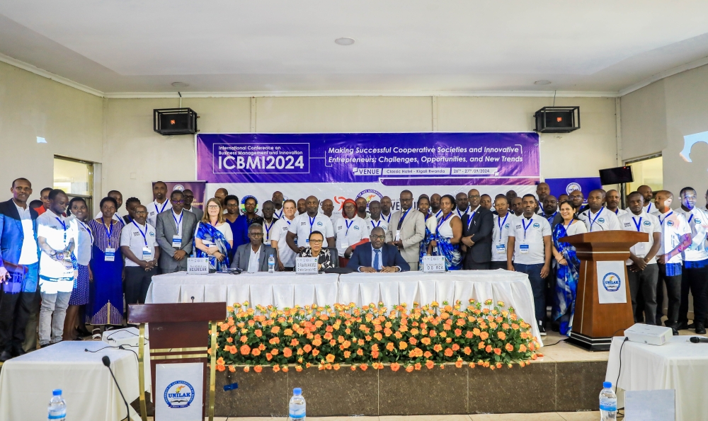 Participants and officials pose for a group photo during the conference in Kigali on September 26.