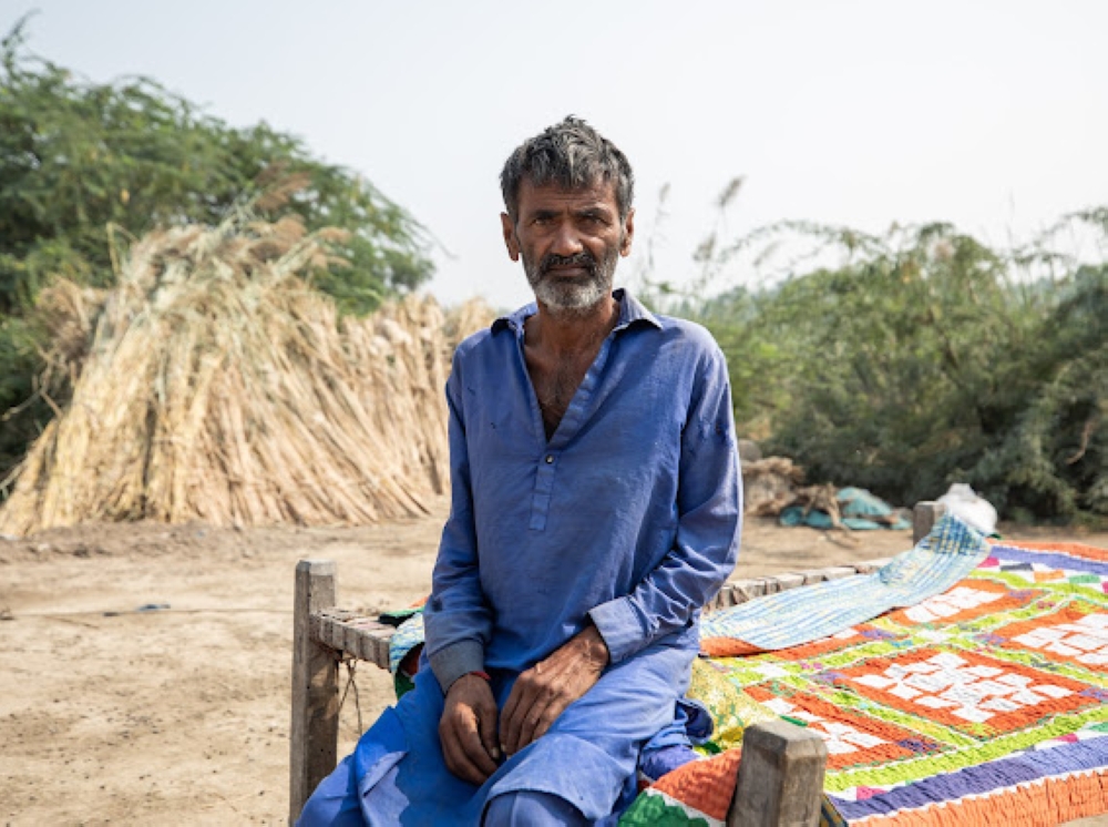 Ameer Dino, a local resident of Village Hussain Dafrani, Thatta, Sindh, Pakistan at an open field he calls home. (21st November, 2023)