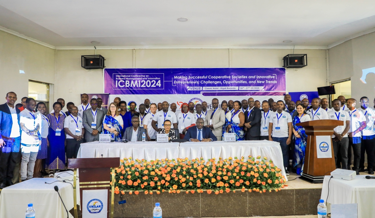 Participants and officials pose for a group photo during the conference in Kigali on September 26.