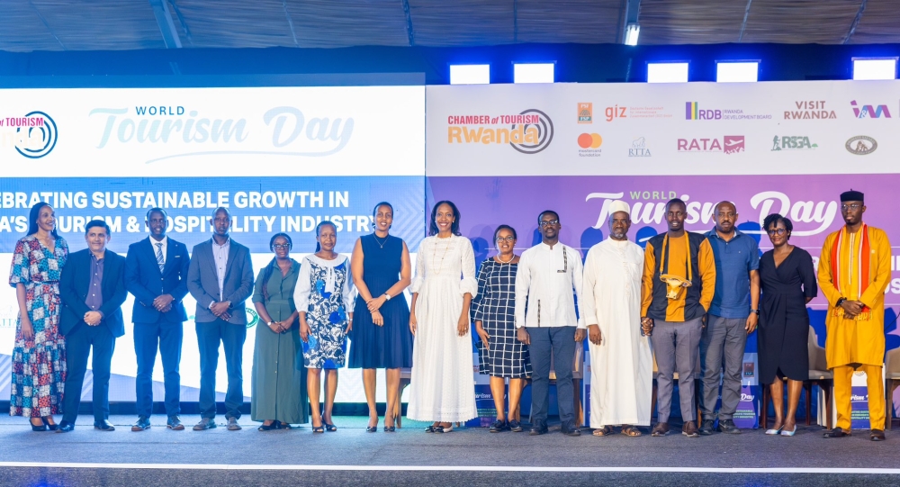 Officials and beneficiaries pose for a photo during the launch of Kataza Programme  on World Tourism Day on September 27.