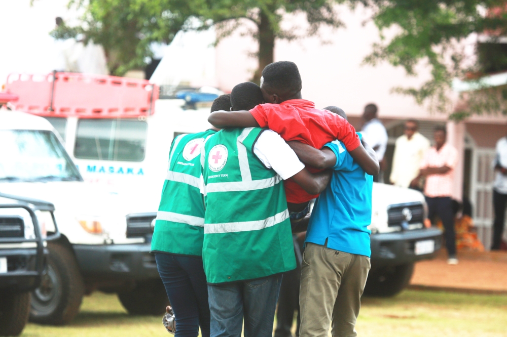 Volunteers help a trauma victim during a commemoration event at Kicukiro Nyanza Genocide Memorial on May 4, 2019. Sam Ngendahimana