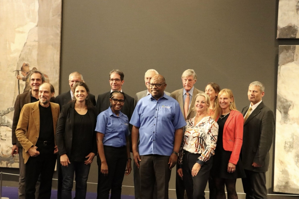 Dr Sam Kanyamibwa, ARCOS Founder and chief executive (C), and officials and delegates pose for a photo after receiving the award in Bern, Switzerland. Courtesy