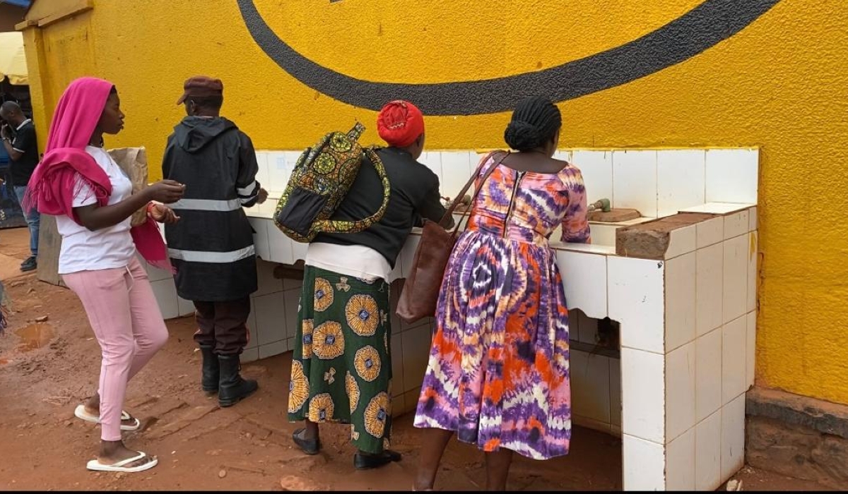 Residents wash hands at Kimironko market. Photos by Joan Mbabazi