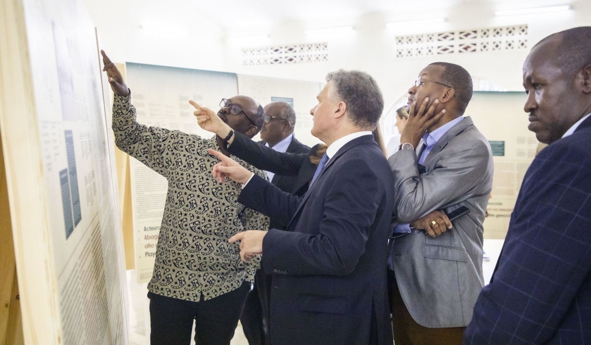 French Ambassador to Rwanda Antoine Anfré and other delegates during a guided tour of a scientific exhibition dubbed &#039;Traces of the Genocide Against the Tutsi&#039; launched  on October 1. All Photos by Emmanuel Dushimimana