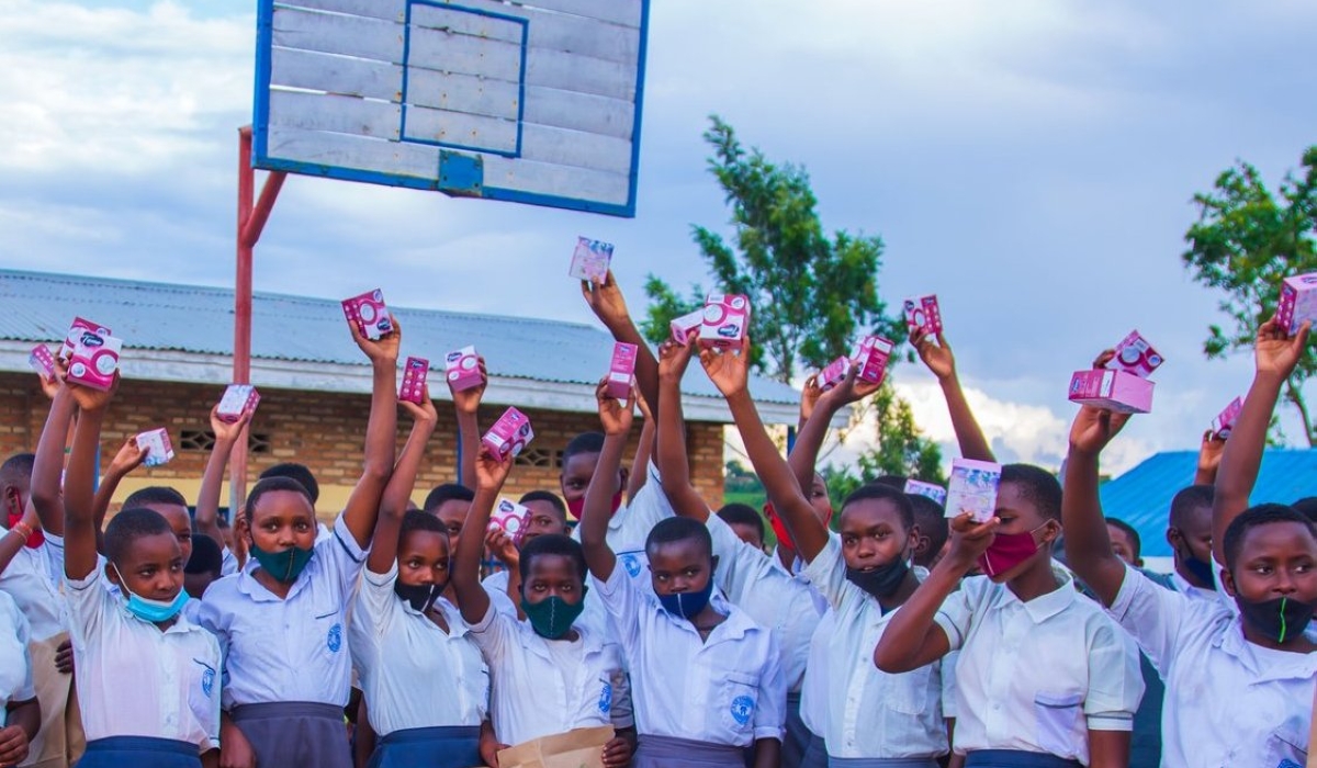 Girls in Gisagara show free pads that they got from an activist. In 2019, the Rwandan government added sanitary pads to the list of goods that are VAT exempted in a bid to ease their affordability. Photos: Courtesy