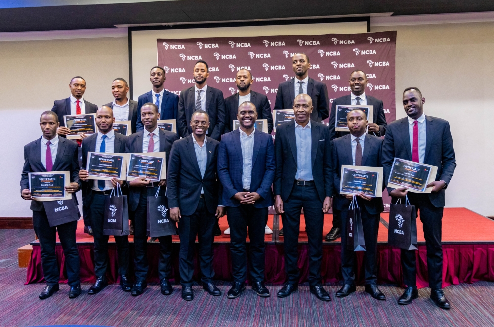 Officials and Man Enough graduates pose for a photo during the graduation ceremony on Friday, October 3. Man Enough, a groundbreaking program aimed at empowering men to become advocates for gender equality has concluded successfully.  All photos by Craish Bahizi