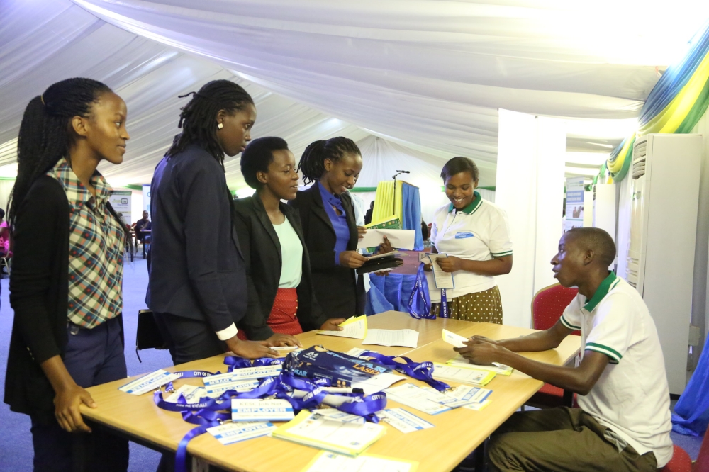 Job seekers follow jobnet Rwanda staff&#039;s guidance while briefing them on job-seeking procedures during an annual event where job seekers meet job providers in Kigali. File