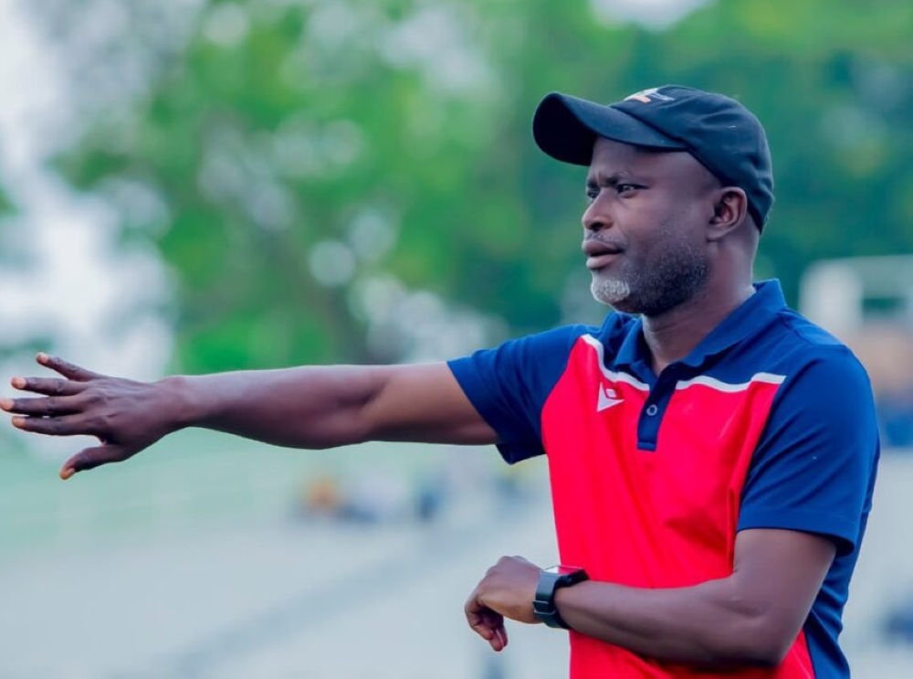 Gorilla FC head coach Alain Kirasa gives instructions to his players during the game.