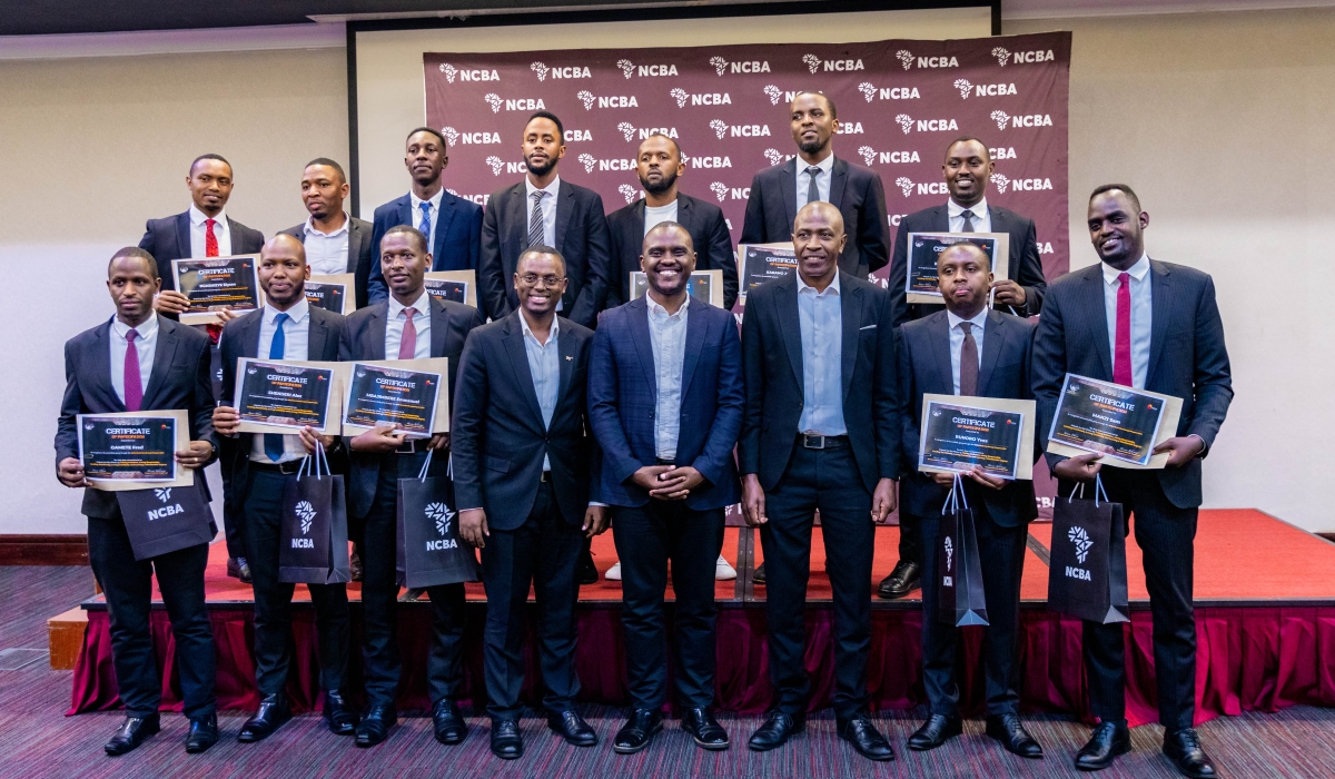 Officials and Man Enough graduates pose for a photo during the graduation ceremony on Friday, October 3. Man Enough, a groundbreaking program aimed at empowering men to become advocates for gender equality has concluded successfully.  All photos by Craish Bahizi