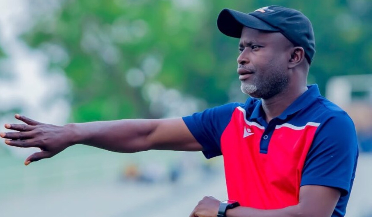 Gorilla FC head coach Alain Kirasa gives instructions to his players during the game.