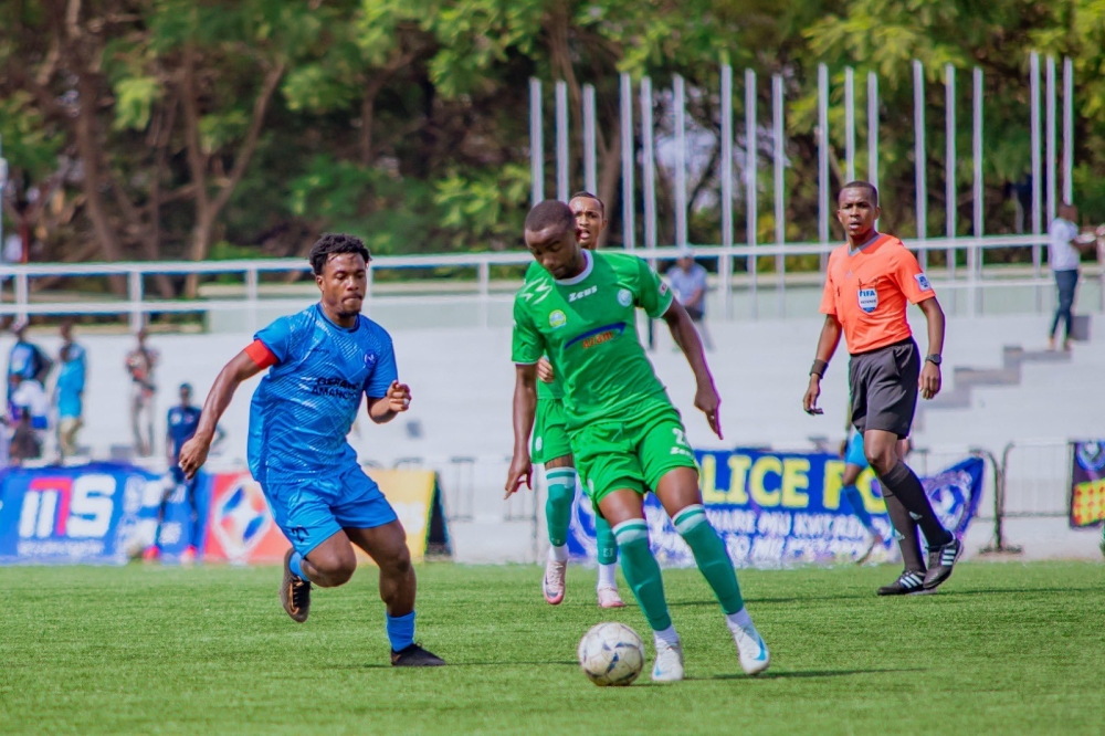 SC Kiyovu player tries to go past Police FC skipper Abedi Bigirimana during the 0-4 league match  at Kigali Pele stadium on September 26. Courtesy