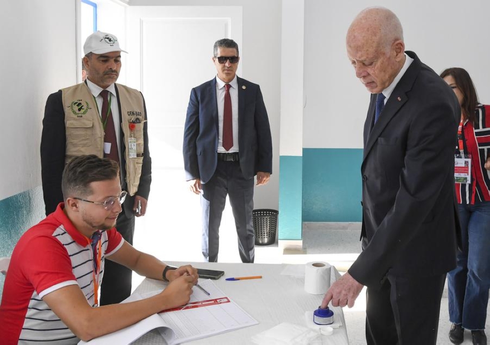 Tunisian President Kais Saied (R, front) registers at a polling center in Tunis, Tunisia on Oct. 6, 2024.  (Tunisian Presidency/Handout via Xinhua)