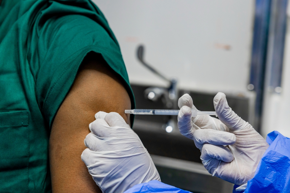 A health worker during the Marburg vaccination activity in Kigali on Sunday. Rwanda, on October 6, kicked off a trial vaccination drive focused on people at highest risk of contracting Marburg virus. Courtesy