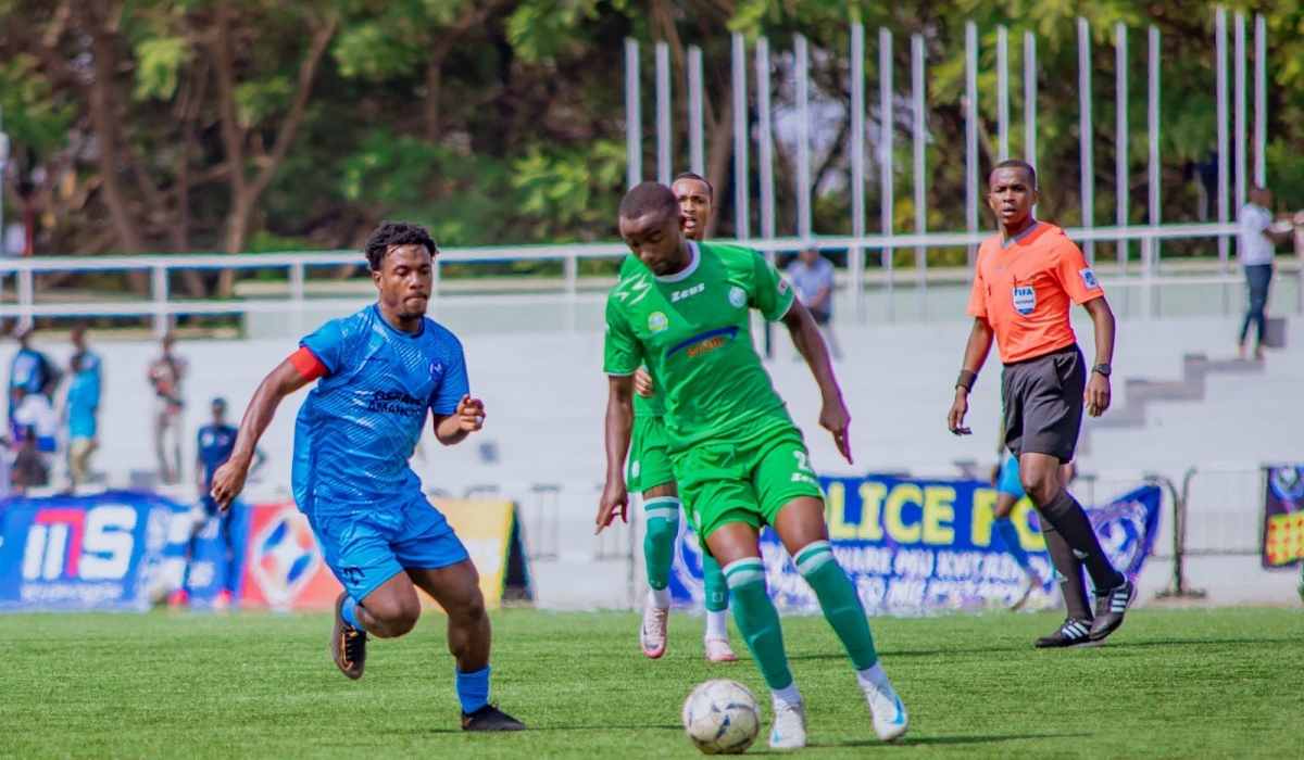 SC Kiyovu player tries to go past Police FC skipper Abedi Bigirimana during the 0-4 league match  at Kigali Pele stadium on September 26. Courtesy