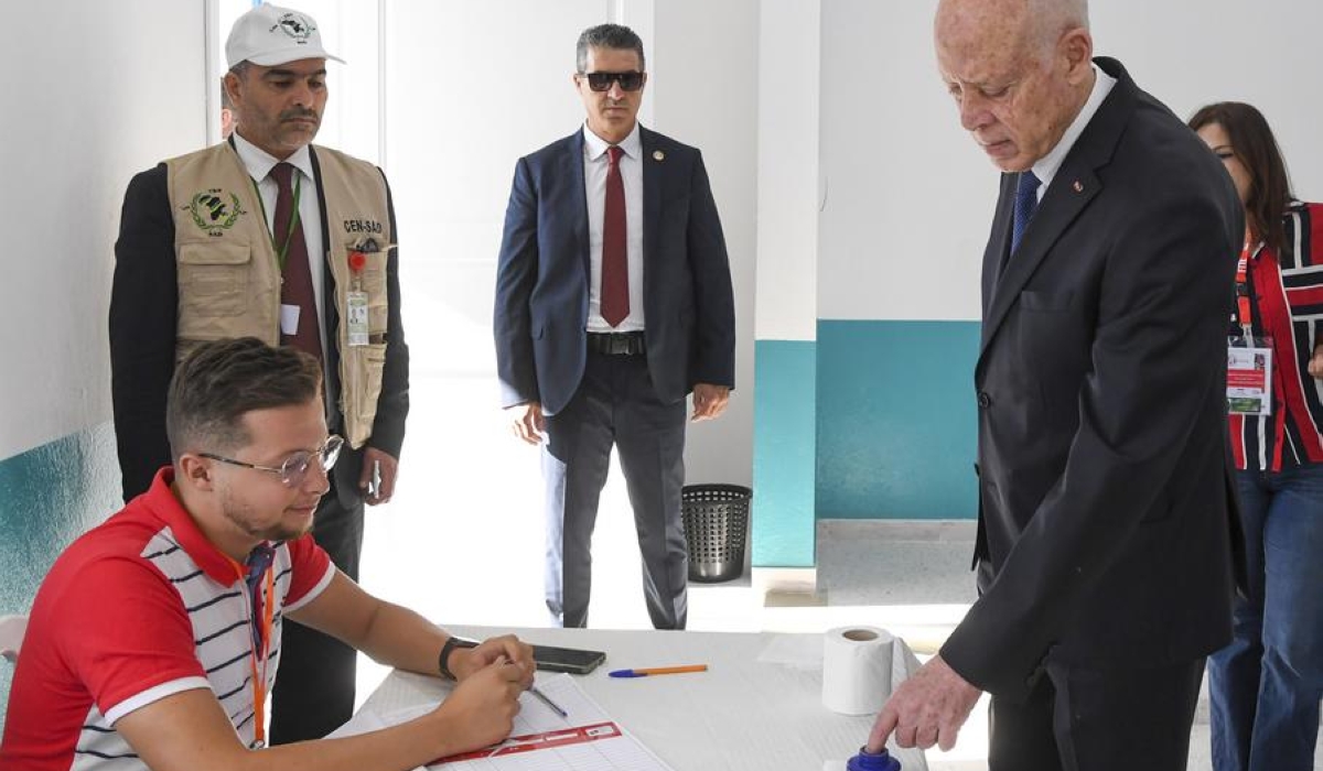 Tunisian President Kais Saied (R, front) registers at a polling center in Tunis, Tunisia on Oct. 6, 2024.  (Tunisian Presidency/Handout via Xinhua)