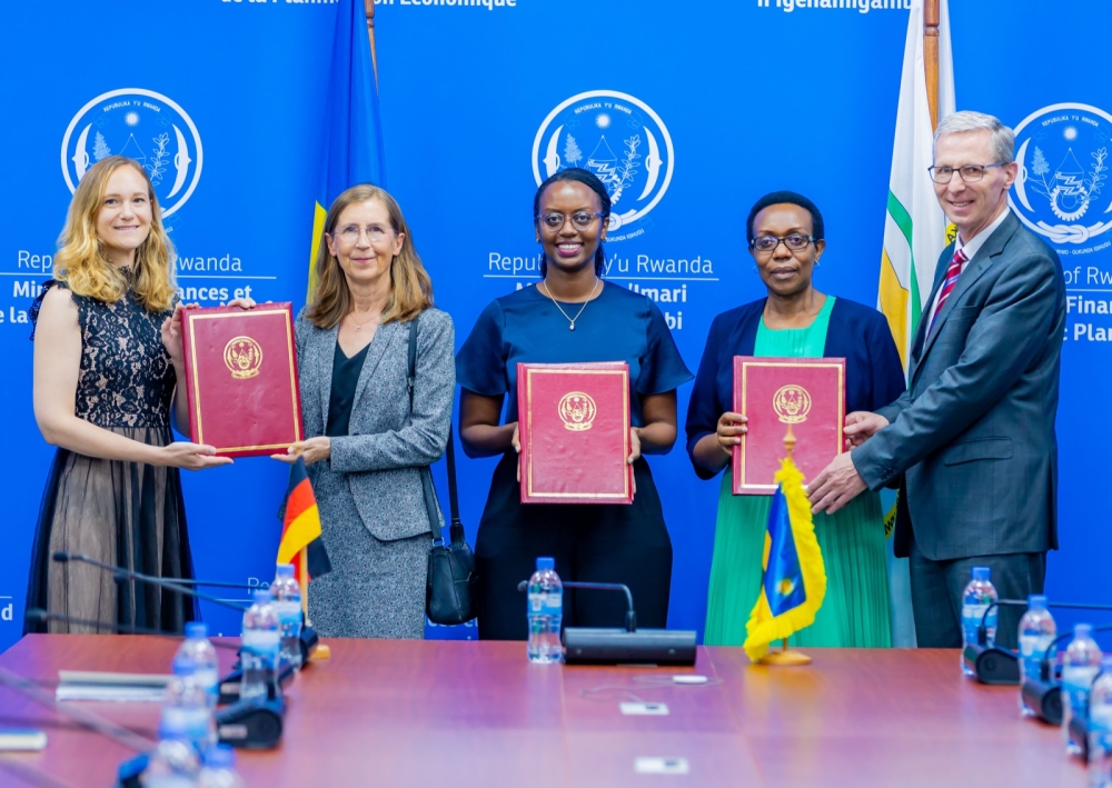 Officials pose for a photo during the signing ceremony in Kigali on Tuesday, October 8. The fund aimed at improving access to public services, rehabilitating infrastructure, creating employment opportunities.