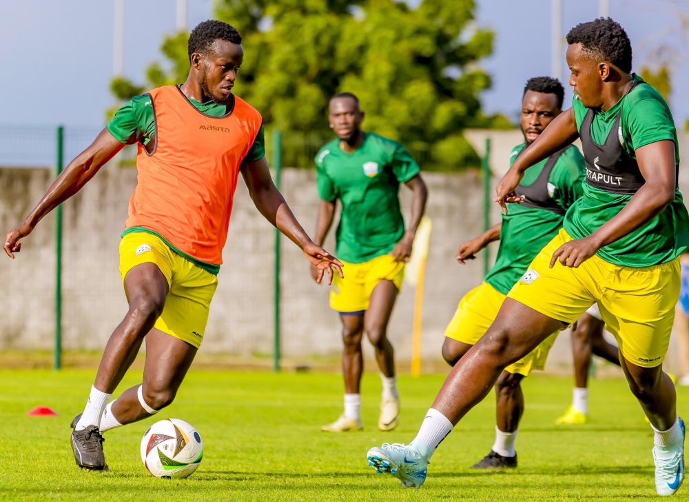 National team&#039;s Ange Mutsinzi tries to dribble past Striker Innocent Nshuti during their first training in Ivory Coast. Rwanda will face Benin at the Felix Houphouet-Boigny Stadium in Abidjan, on Friday.