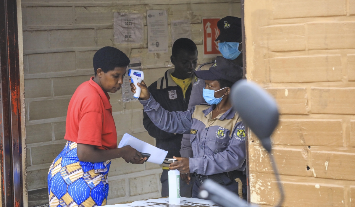 Security officers screen a woman before entiring CHUK hospital in Kigali on Tuesday, October 8. 