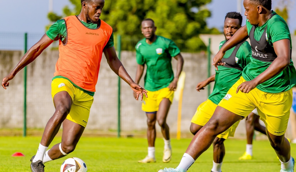 National team&#039;s Ange Mutsinzi tries to dribble past Striker Innocent Nshuti during their first training in Ivory Coast. Rwanda will face Benin at the Felix Houphouet-Boigny Stadium in Abidjan, on Friday.