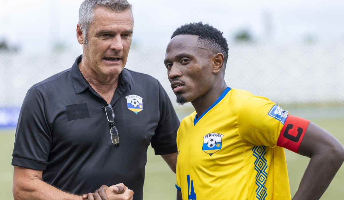 Torsten Spittler, the Amavubi head coach talks to Skipper Djihad Bizimana during a goalless draw against Zimbabwe at Huye stadium on November 15, 2023. Photo by OLIVIER MUGWIZA