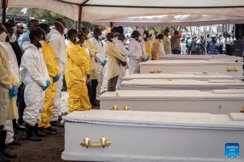 Pallbearers stand in front of coffins during a funeral for victims of a recent ferry accident in Goma, the capital of the North Kivu Province in the eastern Democratic Republic of the Congo (DRC), on Oct. 10, 2024. (Photo by Zanem Nety Zaidi/Xinhua