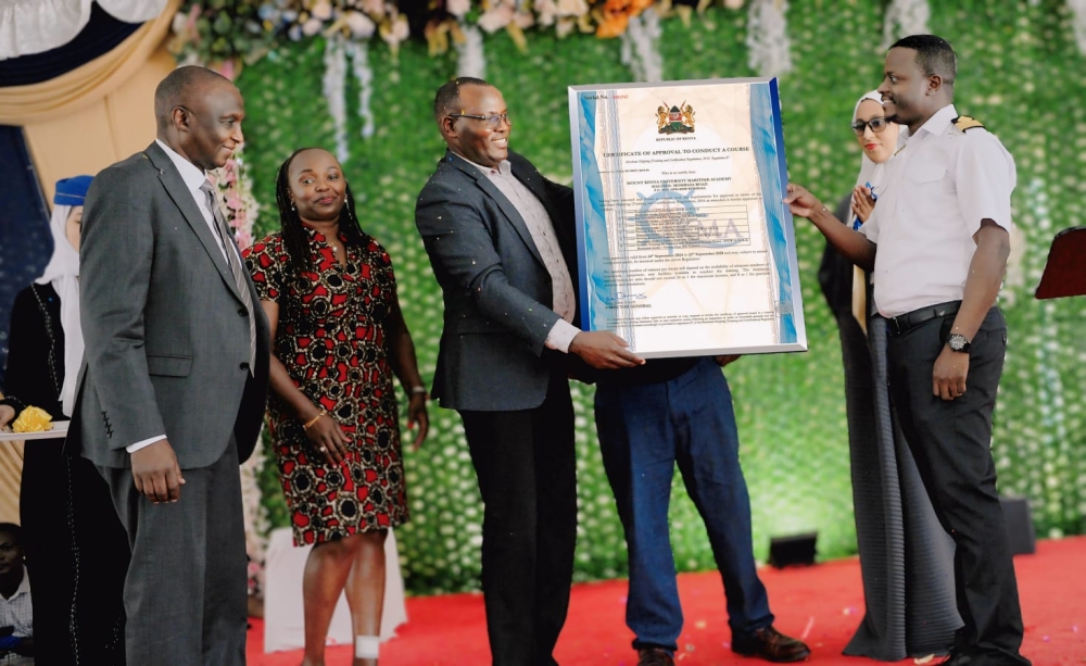 Captain Peter Munga of Kenya Maritime Authority presents the accreditation certificate to MKU Council Chairman Dr Vincent Gaitho and Vice-Chancellor Prof. Deogratius Jaganyi during the launch.