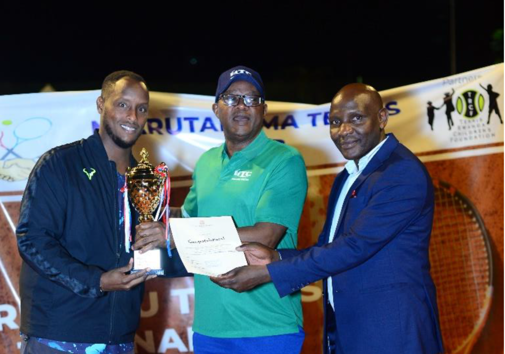 Aimé Rugwiza was presented the winner’s trophy by Jonathan Cheres, the General Manager of Kivu Serena Hotel, and the President of Nyarutarama Tennis Club, Bart Gasana.