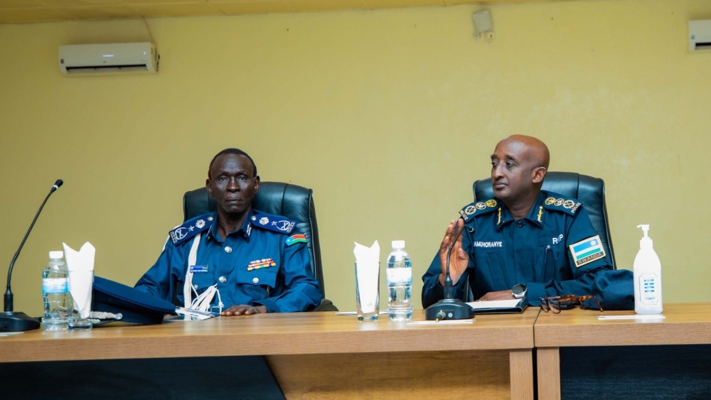 Gen. Jackson Elia, the Assistant Inspector General for Human Resources and Training of SSNPS, Inspector General of Police (IGP) CG Felix Namuhoranye during the accomplishment event  of joint training in aviation security and public order management  on Friday, October 11.