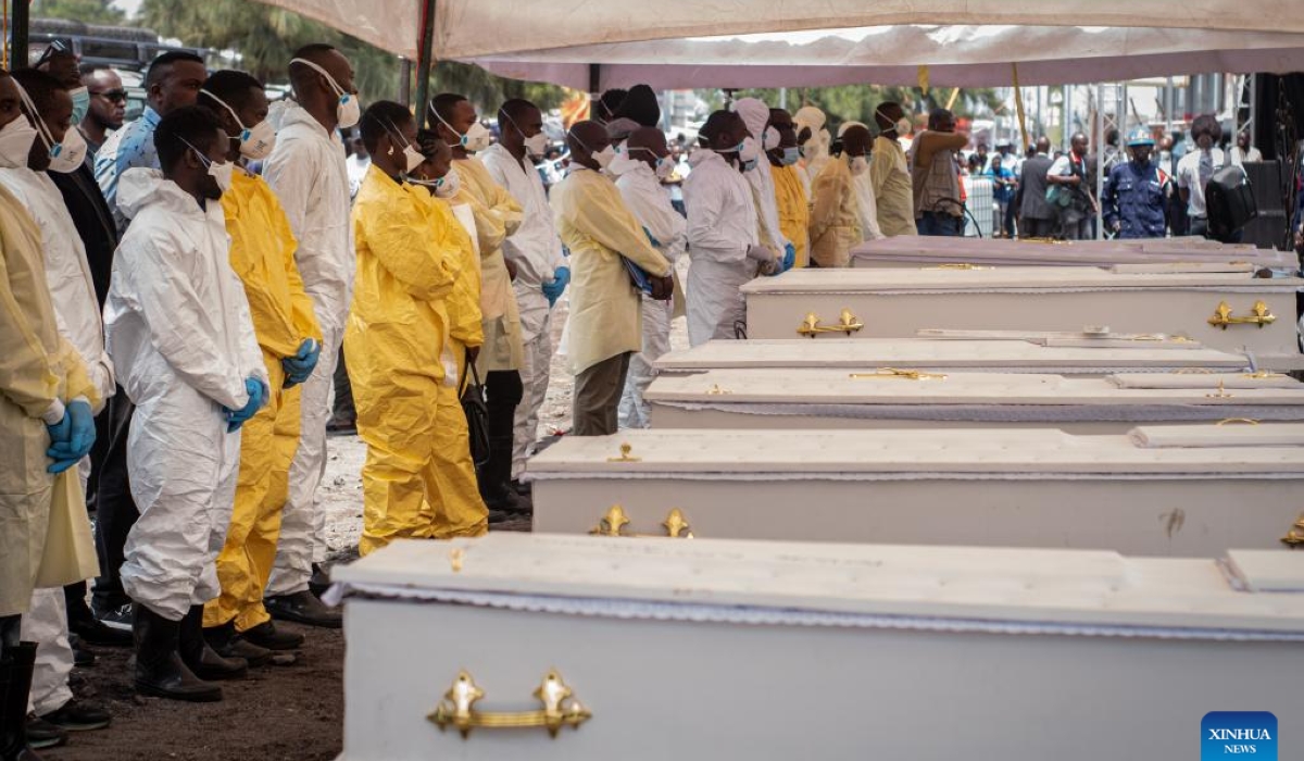 Pallbearers stand in front of coffins during a funeral for victims of a recent ferry accident in Goma, the capital of the North Kivu Province in the eastern Democratic Republic of the Congo (DRC), on Oct. 10, 2024. (Photo by Zanem Nety Zaidi/Xinhua