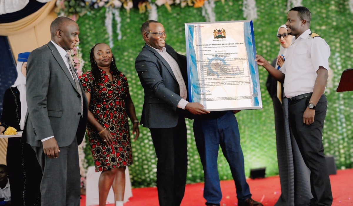 Captain Peter Munga of Kenya Maritime Authority presents the accreditation certificate to MKU Council Chairman Dr Vincent Gaitho and Vice-Chancellor Prof. Deogratius Jaganyi during the launch.