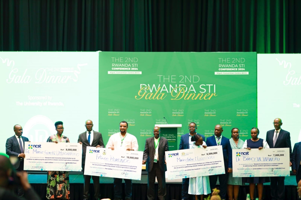 Prince Rukundo, fourth from left, was recognized as the best researcher at the conference. COURTESY