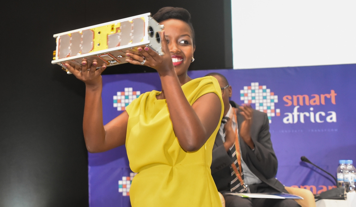 Paula Ingabire, the Minister of ICT and Innovations holds Rwanda&#039;s satellite&#039; RWASAT-1 on May 16, 2019. TRL Space CEO and founder, Petr Kapoun revealed that Rwanda&#039;s first hyperspectral satellite is being built. File