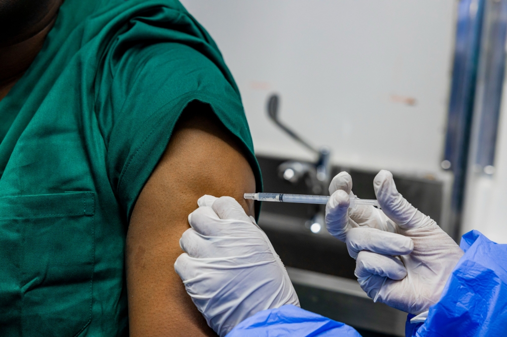 A health care worker administers a vaccine for Marburg virus disease in Kigali on October 6, 2024. Courtesy 