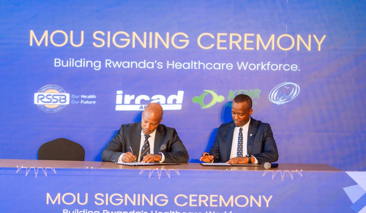 King Kayondo, President of IRCAD Africa and Regis Rugemanshuro, the CEO of RSSB sign the agreement in Kigali.